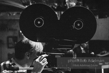 Andy Warhol behind the camera during the filming of 