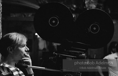 Andy Warhol behind the camera during the filming of 