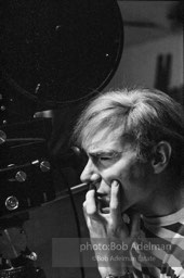 Andy Warhol behind the camera during the filming of 