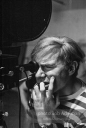 Andy Warhol behind the camera during the filming of 