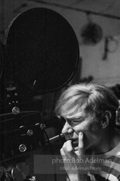 Andy Warhol behind the camera during the filming of 