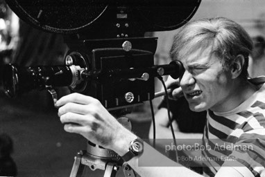 Andy Warhol behind the camera during the filming of 