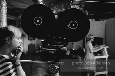 Andy Warhol behind the camera during the filming of 