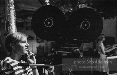 Andy Warhol behind the camera during the filming of 