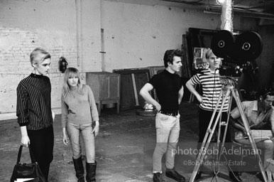 Left to right: Edie Sedgwick,
Bibbe Hansen, Gerard Malanga,
Andy Warhol and Buddy
Wirtschafter during the filming
of Prison (aka Girls In Prison). The Factory, 1965.