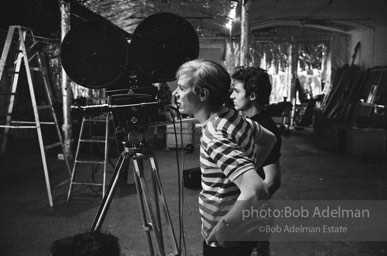 Andy Warhol behind the camera during the filming of 