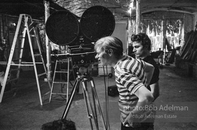 Andy Warhol behind the camera during the filming of 