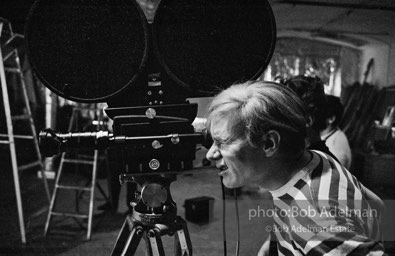 Andy Warhol behind the camera during the filming of 