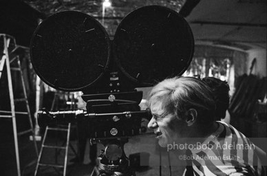 Andy Warhol behind the camera during the filming of 