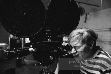 Andy Warhol behind the camera during the filming of 