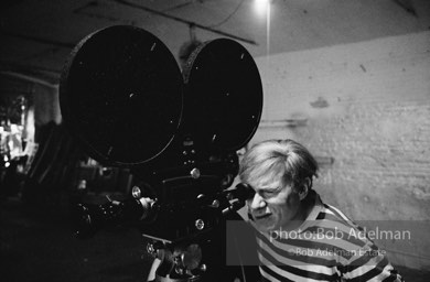 Andy Warhol behind the camera during the filming of 