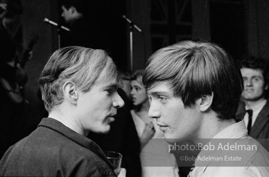 Andy Warhol and Gino Piserchio at a party. New York City, 1965