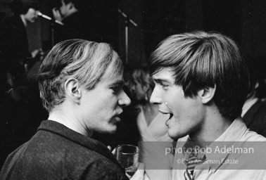 Andy Warhol and Gino Piserchio at a party. New York City, 1965