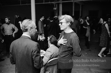 Leo Castelli and Andy Wahol at a party at Robert Rauschenbergs loft. New York City, 1965.