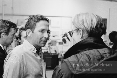 Robert Rauschenberg and Andy Warhol at a party at Raucshenberg's loft. New York city, 1965.