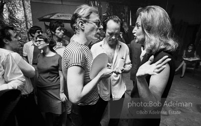 Andy with Edith Skull (art collector) talk at a Factory party for John Rublowsky and Ken Heyman’s book Pop Art..1965.