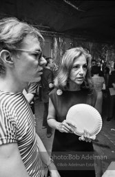 Andy with Edith Skull (art collector) talk at a Factory party for John Rublowsky and Ken Heyman’s book Pop Art..1965.