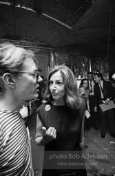 Andy with Edith Skull (art collector) talk at a Factory party for John Rublowsky and Ken Heyman’s book Pop Art..1965.