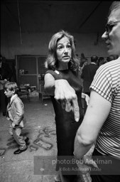 Andy with Edith Skull (art collector) talk at a Factory party for John Rublowsky and Ken Heyman’s book Pop Art..1965.