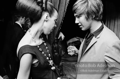 Isabel Nash Eberstatd and Chuck Wein at a society party. New York City, 1965.