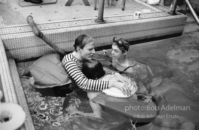 Andy Warhol, Edie Sedgwick and Chuck Wein ata pool party at Al Roon's gym.New York City, 1965.