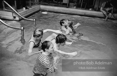 Andy Warhol, Edie Sedgwick ,Chuck Wein and Baby Jane Holzer at a pool party at Al Roon's gym.New York City, 1965.