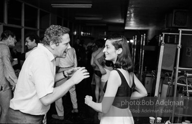 Artist Marisol Escobar dances at a party at Al Roon's gym. New York City, 1965.