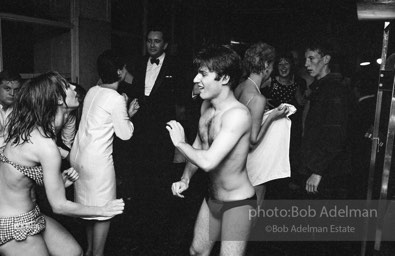 Gerard Melanga dances at a pool party at Al Roon's Gym. New York City, 1965.
