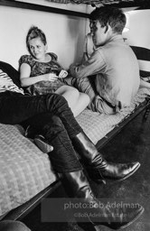 Andy Warhol with unidentified guests horsing around on the bunk beds at a dinner party. New York City, 1965.