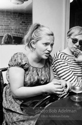 Andy Warhol and Edie Sedgwick with unidentified guests at an east-side dinner party. New York City, 1965.