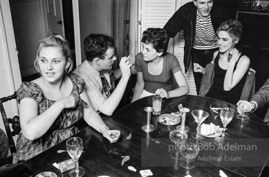 Andy Warhol and Edie Sedgwick with unidentified guests at an east-side dinner party. New York City, 1965.