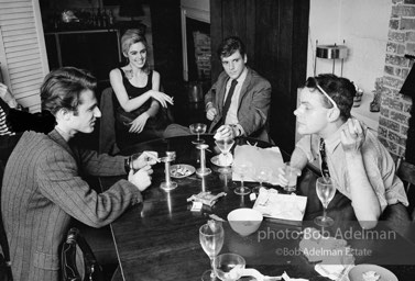 Gerard Melanga, Andy Warhol, Edie Sedgwick with unidentified guests at an east-side dinner party. New York City, 1965.