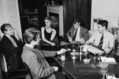 Gerard Melanga, Andy Warhol, Edie Sedgwick with unidentified guests at an east-side dinner party. New York City, 1965.