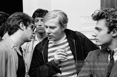 Andy Warhol and Gerard Melanga with unidentified guests at a party. New York City, 1965.