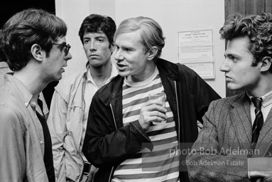 Andy Warhol and Gerard Melanga with unidentified guests at a party. New York City, 1965.