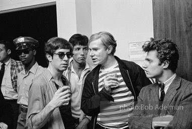 Andy Warhol and Gerard Melanga with unidentified guests at a party. New York City, 1965.