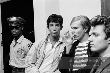 Andy Warhol and Gerard Melanga with unidentified guests at a party. New York City, 1965.