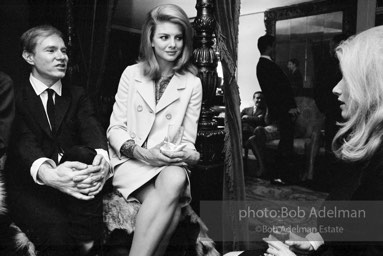 Andy Warhol and Edie Sedgwick with an unidentified guest at a society party. New York City, 1965.