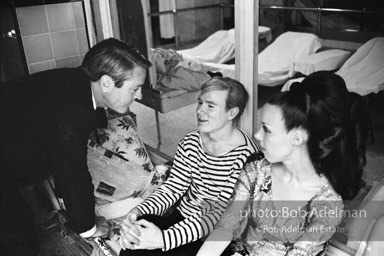 Actor Kevin McCarthy, Andy Warhol and writer and arts patron Isabel Nash Eberstadt at a pool party at Al Roon's gym. New York City, 1965.