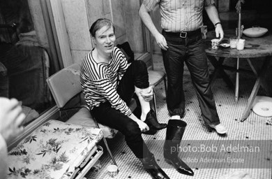 Andy Warhol after being pushed into the pool by Edie Sedgwick. Al Roon's Gym, New York City, 1965.