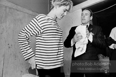 Movie star, Kevin McCarthy with Edie Sedgwick at a pool party at Al Roon's gym, New York City, 1965.