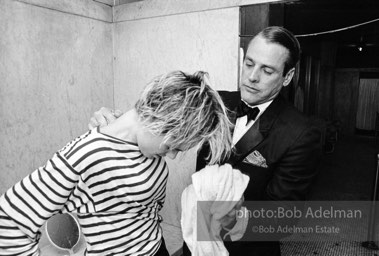 Movie star, Kevin McCarthy with Edie Sedgwick at a pool party at Al Roon's gym, New York City, 1965.