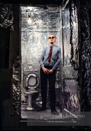 Andy Warhol in the silver foil covered bathroom at the Factory, 1965.