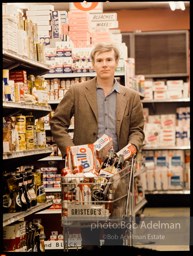 Andy Warhol shops at Gristede's market. New York City, 1964.