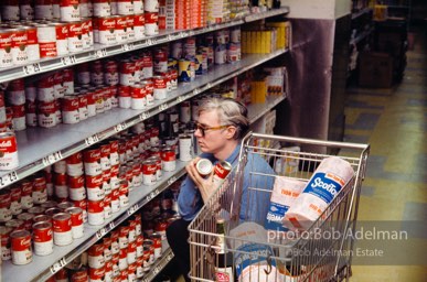 Andy Warhol shops at Gristede's market. New York City, 1964.