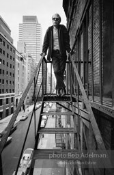 Andy Warhol on the Factory fire escape ouside of the Factory overlooking East 47th St. New York City, 1965.