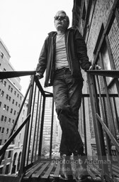 Andy Warhol on the Factory fire escape ouside of the Factory overlooking East 47th St. New York City, 1965.