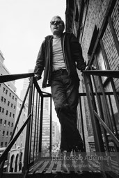 Andy Warhol on the Factory fire escape ouside of the Factory overlooking East 47th St. New York City, 1965.