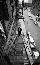 Andy Warhol on the Factory fire escape ouside of the Factory overlooking East 47th St. New York City, 1965.