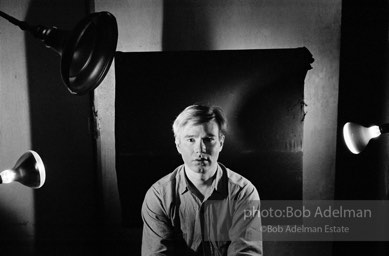 Andy Warhol photographed using his portrait lighting and background cloth at the Factory. 1965.